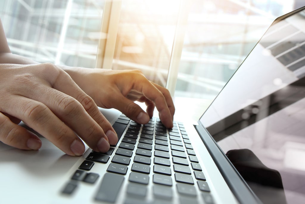 Double exposure of business man hand working on blank screen laptop computer on wooden desk as concept