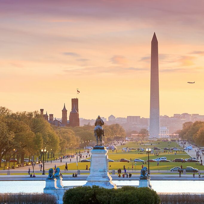 Washington DC city view at a orange sunset, including Washington Monument from Capitol building