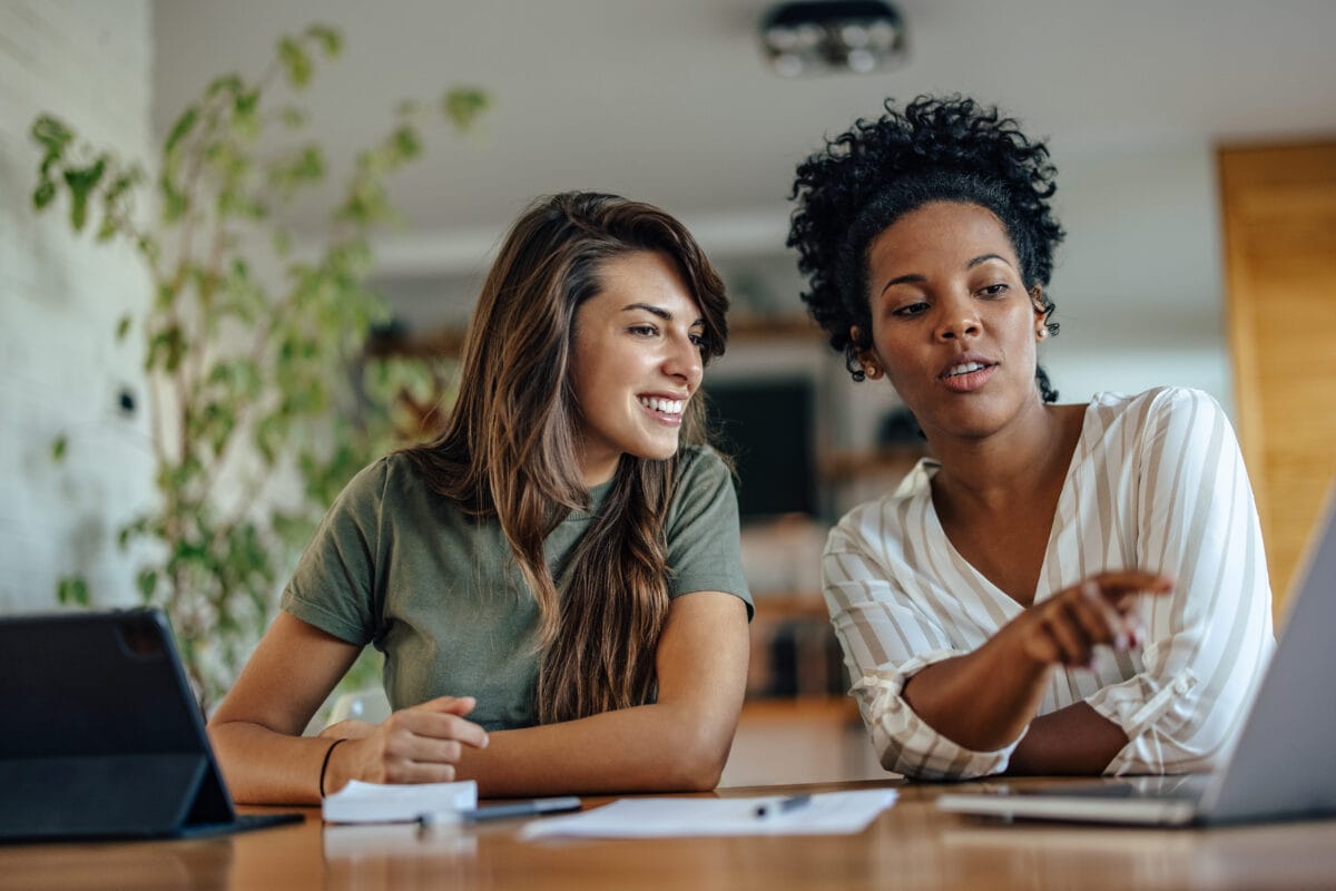 Two diverse friends, improving their knowledge