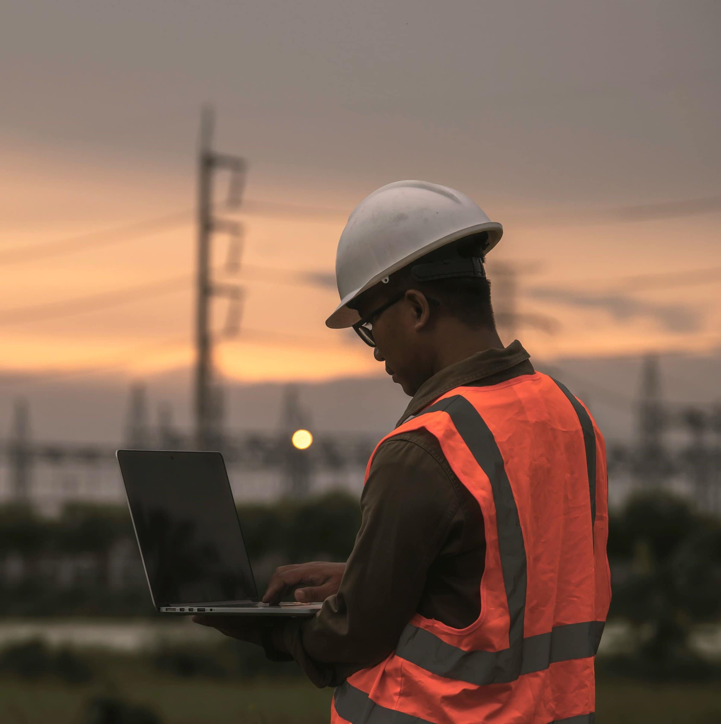 engineer holding his laptop