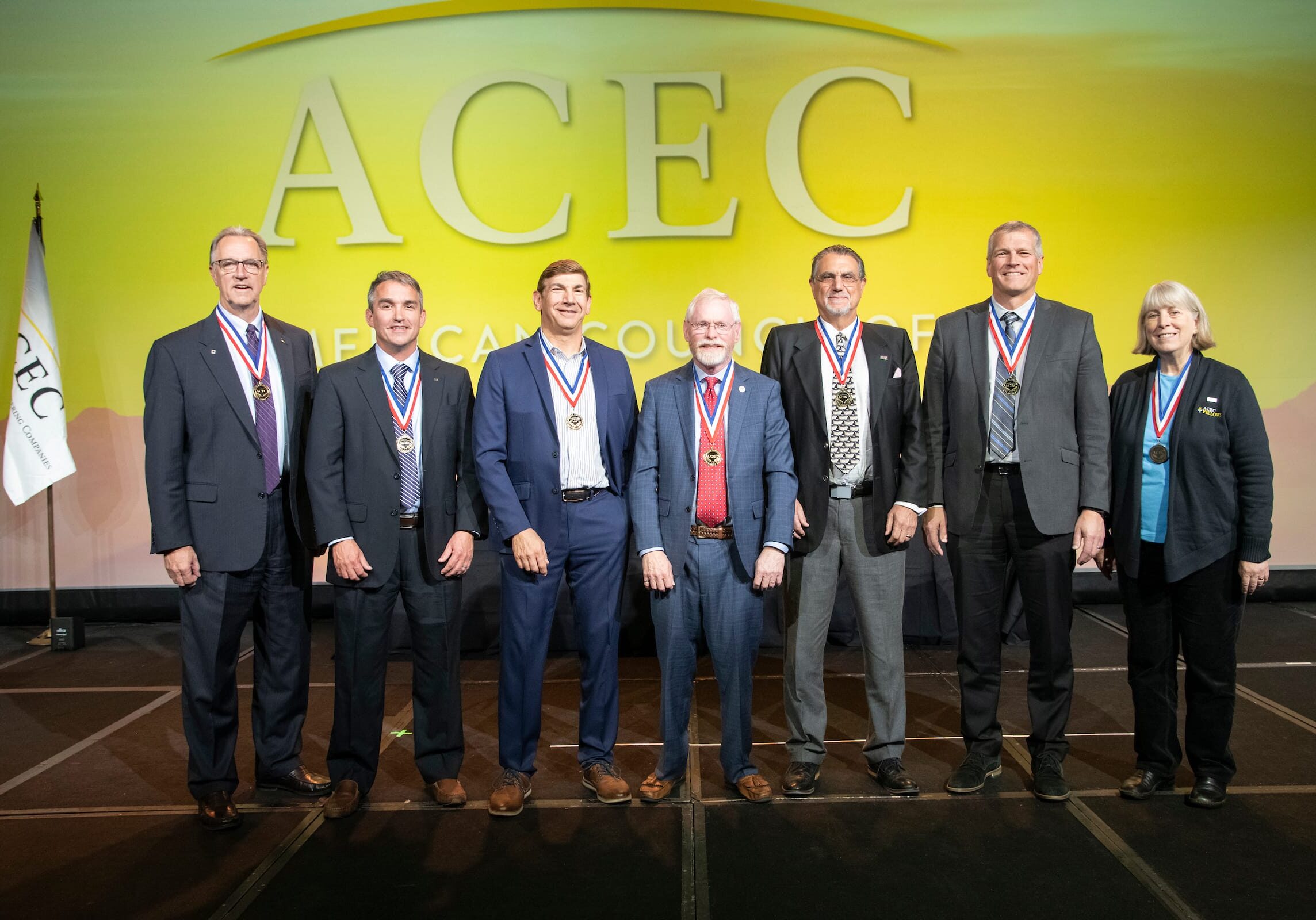 acec members standing on stage during awarding