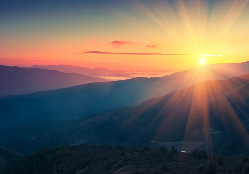 Panoramic view of  colorful sunrise in mountains. Filtered image