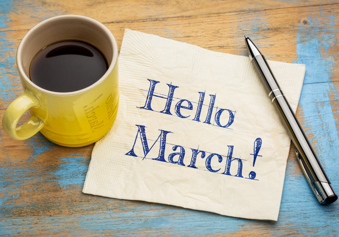 Hello March - handwriting on a napkin with a cup of coffee