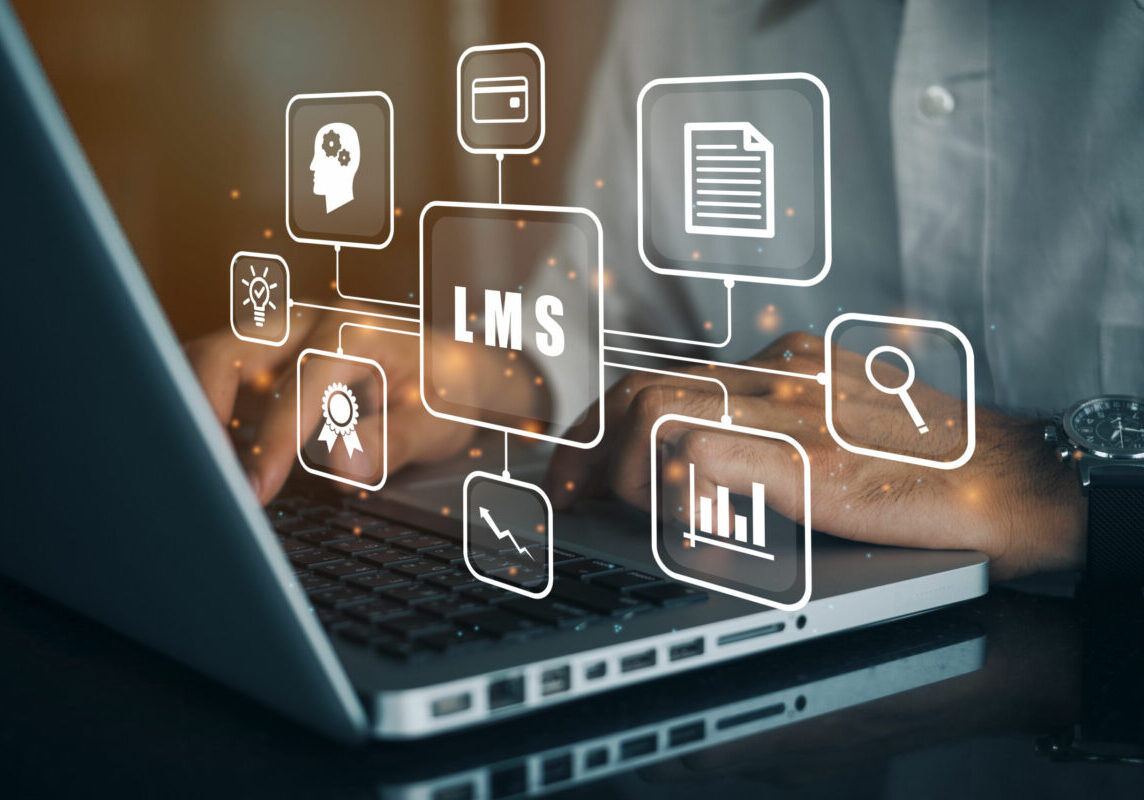 Businessman using a computer to LMS - Learning Management System web icon for lesson and online education, course, application, study, e learning, knowledge everywhere and every time.