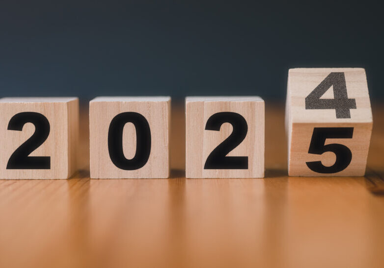 wooden cubes with the text 2024 2025 over background	translated from 2024 to 2025. new business goal strategy concept.2024 goal planning business concept