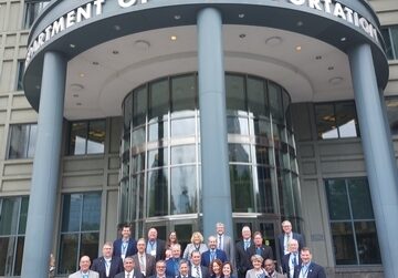 acec members standing in front of the united states department of transportation