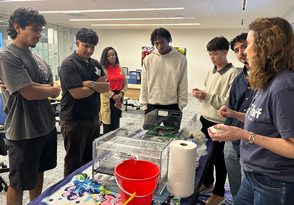 Halff staff conduct flood plain modeling activity for students from the C5 Youth Foundation of Texas.