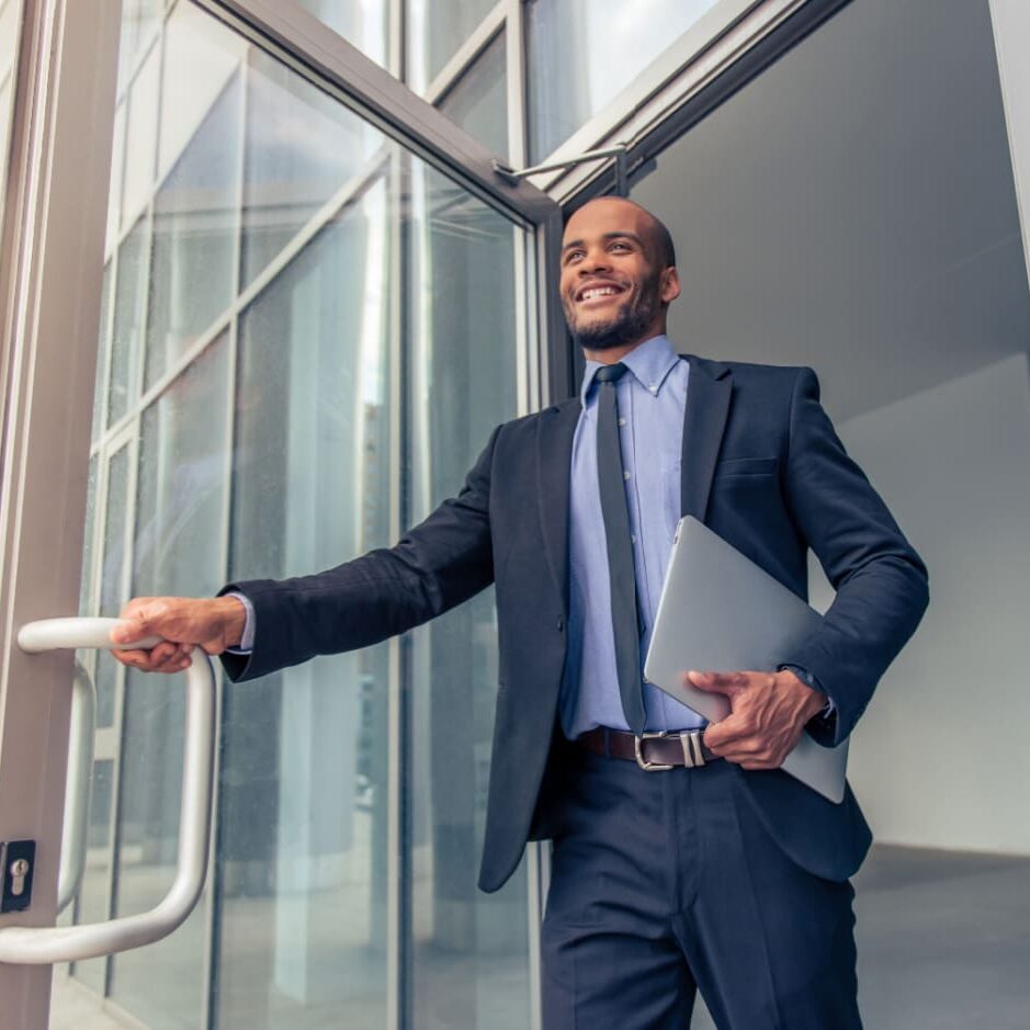 businessman opening office door