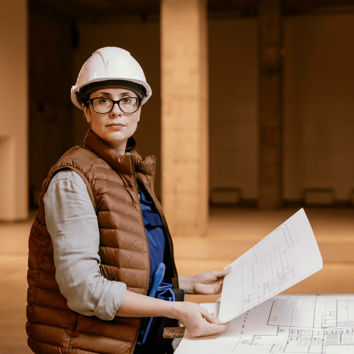 medium shot woman with helmet indoors